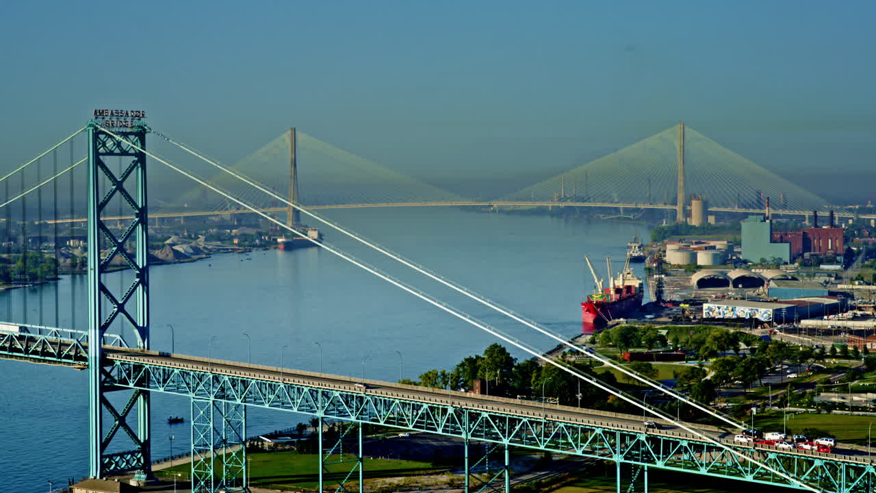 Cinematic overhead drone flyover showing freighter making its way past Detroit’s skyline