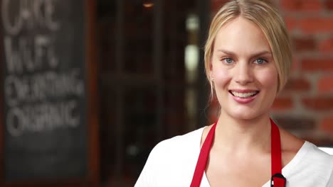 smiling waitress winking at the camera