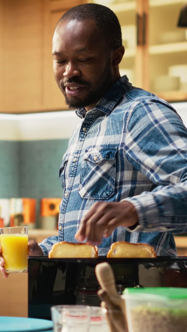Vertical Video Boyfriend and girlfriend preparing bread in toaster together for breakfast table