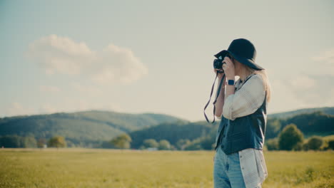 smiling woman photographing through camera