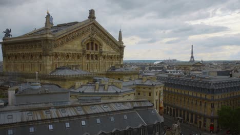 rear exterior of opera garnier as viewed from galeries lafayette in paris, france with eiffel tower in far distance