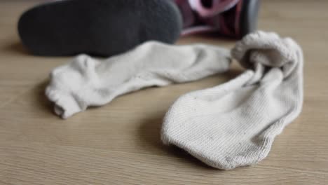 a pair of white socks on the floor