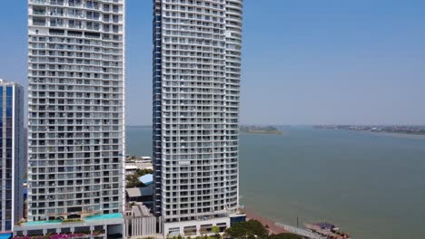 Modern skyline condominium complex residential buildings on Mekong river, Phnom Penh, Aerial