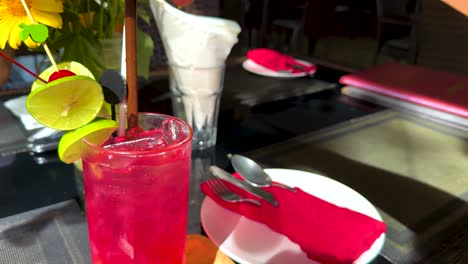 a vibrant drink being prepared and served