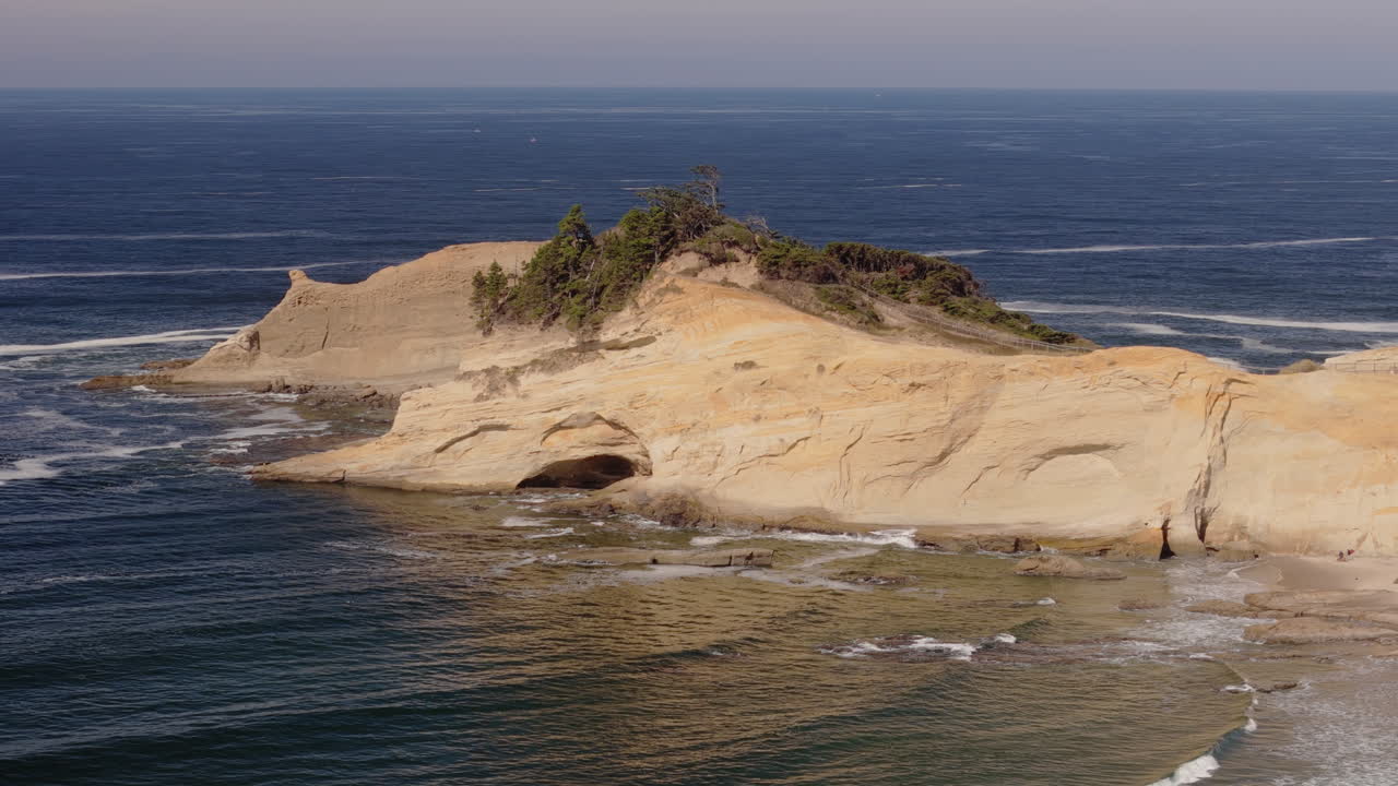 Coastal Landscape with Rocky Formations and Waves
