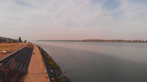 promenade by the river on a beautiful sunny autumn day