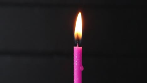 candle on a cake blowing out and relite