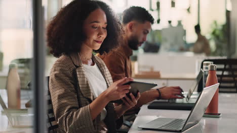 business people working on computers and tablet in office