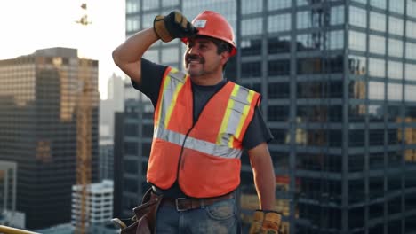 confident construction worker on rooftop overlooking city skyline, enjoying the view and the accomplishment of his hard work amidst skyscrapers and sunshine