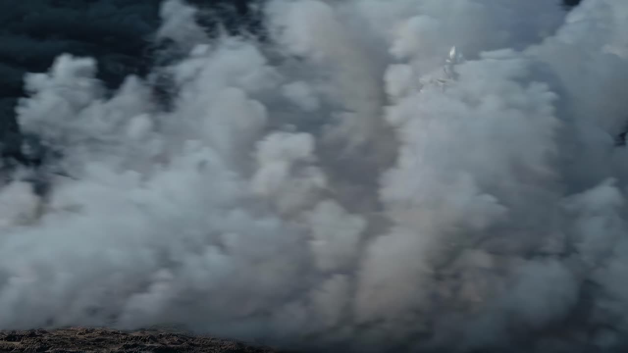 A knight in armor charges forward on horseback through a dusty battlefield