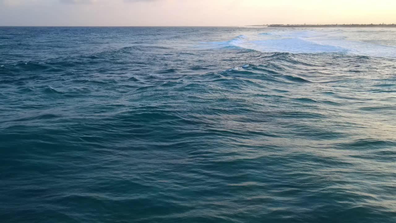 Drone shots of sea waves accompanied by a nice sunset