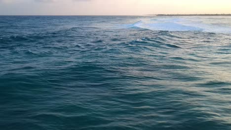 drone shots of sea waves accompanied by a nice sunset