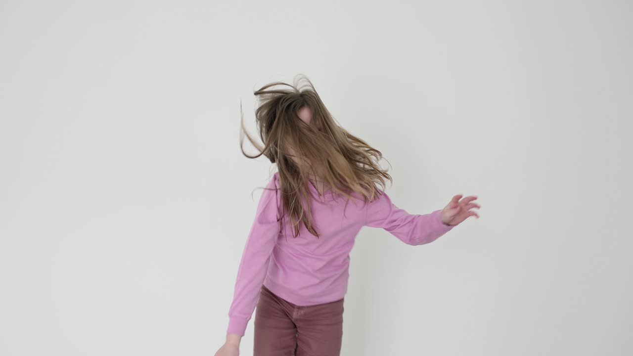 Girl dancing in pink shirt and pants