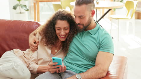 Couple,-relax-and-on-sofa-with-phone-on-social