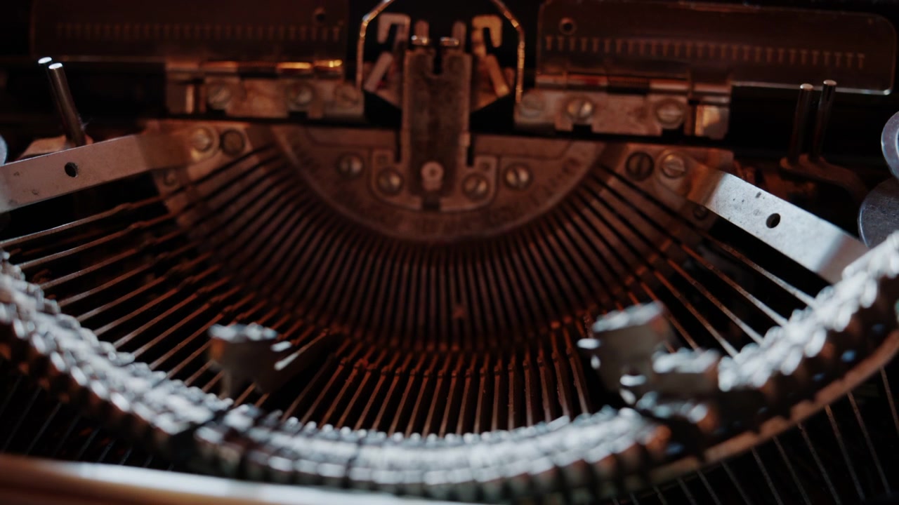 Close up of a vintage mechanical typewriter with visible keys and metal components