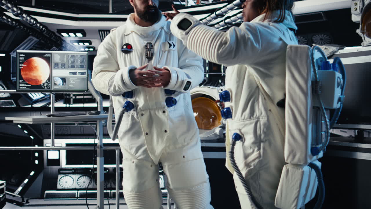 Astronauts discussing last details before stepping out outside space station