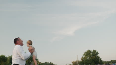 Happy-father-playing-with-his-little-daughter