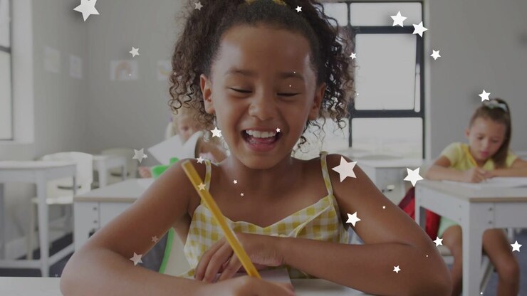 Student writing with yellow pencil in classroom star overlay appearing and causing smiling laughing