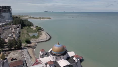 Flyover-copper-dome-of-Melaka-Straits-Mosque-in-Malacca-Malaysia