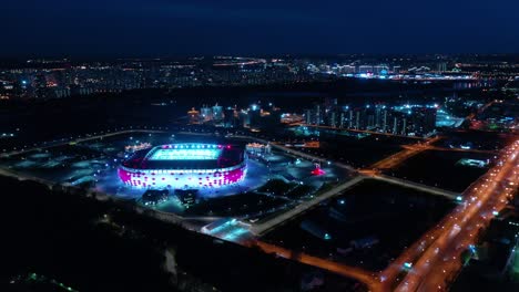 night aerial view of a freeway intersection and football stadium spartak moscow otkritie arena