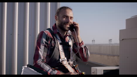 rooftop hvac technician on phone call