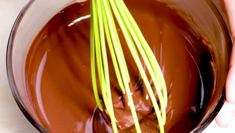 smooth chocolate being whisked in a bowl