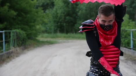 man in red and black costume