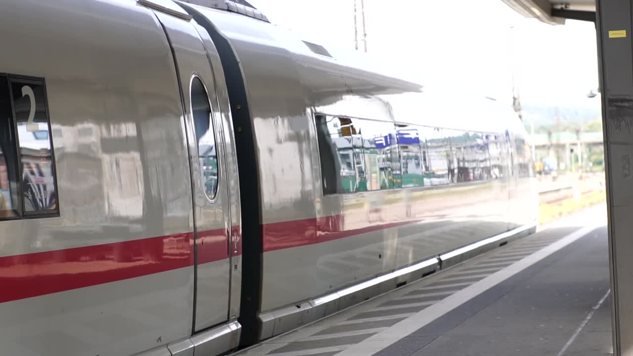A sleek ICE train starts at a German train station, symbolizing modern transportation, efficiency, and travel. Ideal for projects related to urban mobility, infrastructure, and technology.