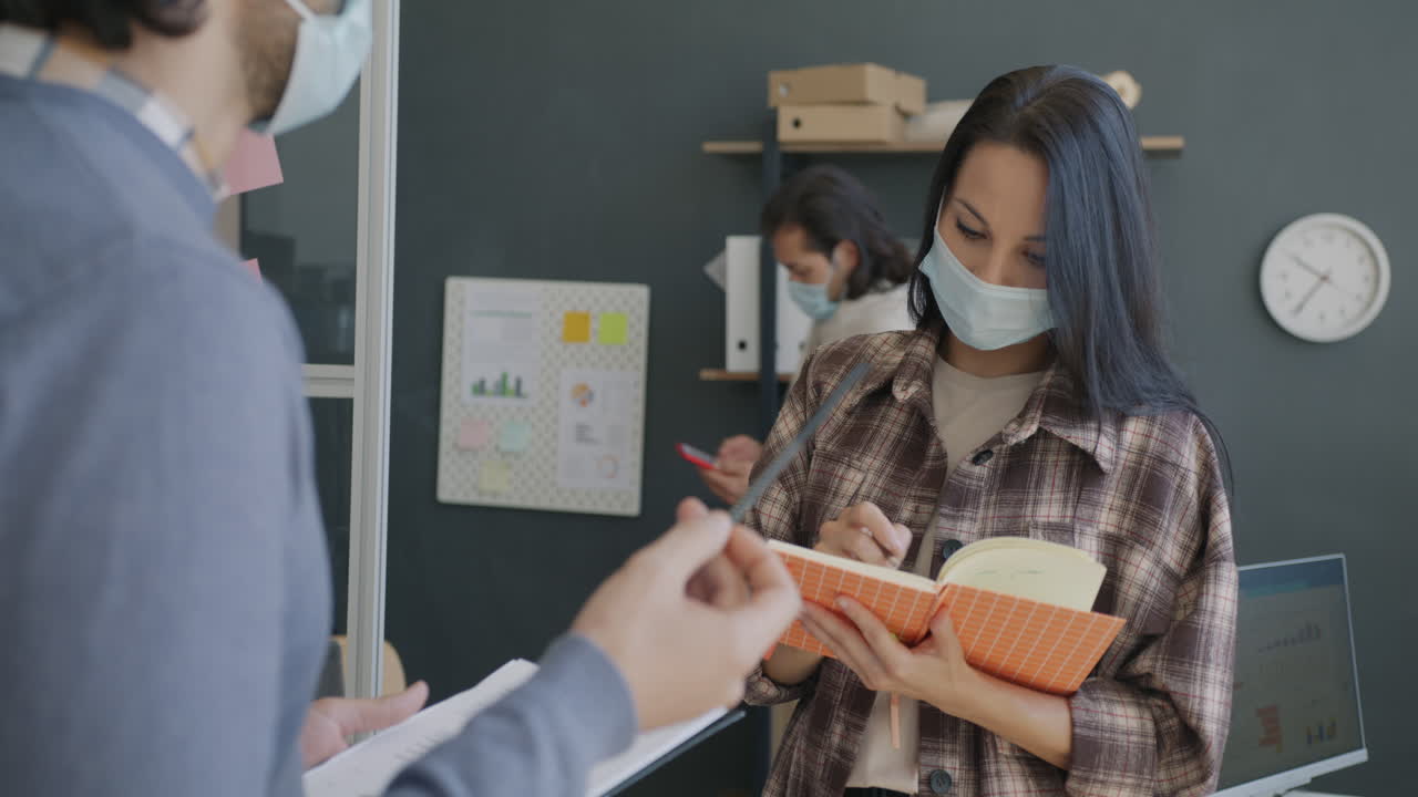 Team Meeting in a Modern Office during Pandemic