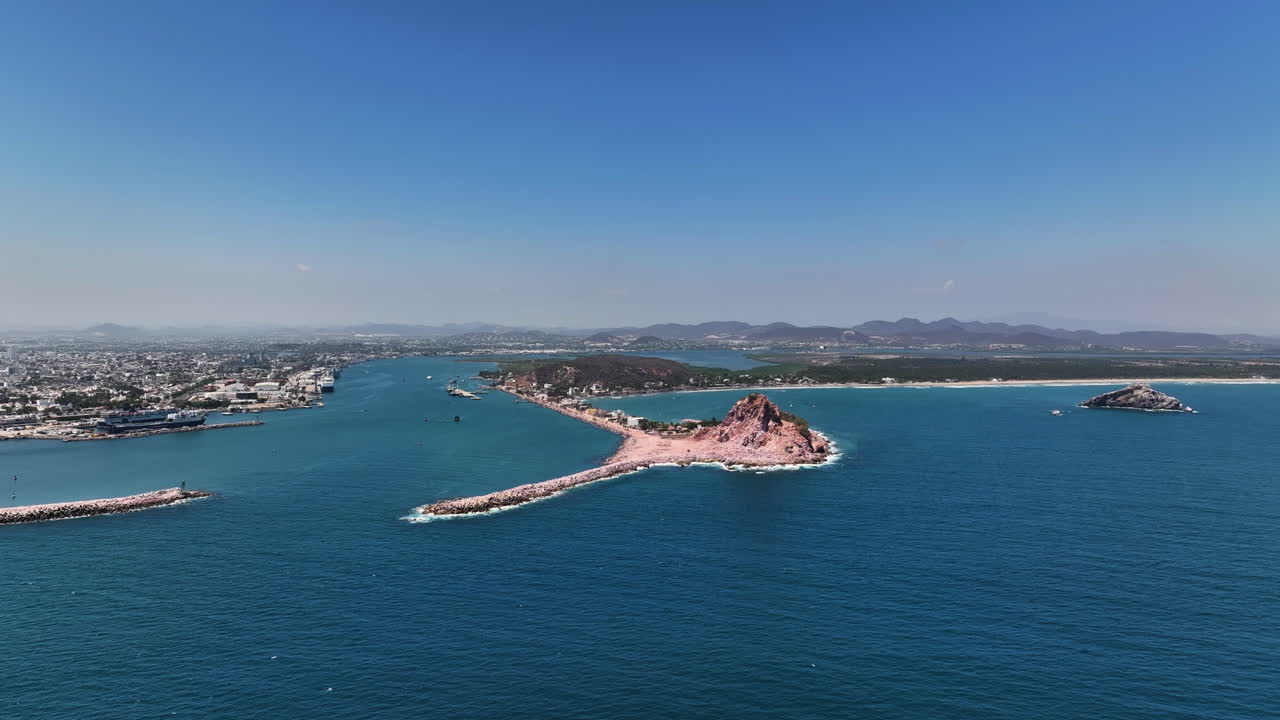Aerial View of a Coastal City with a Rocky Island