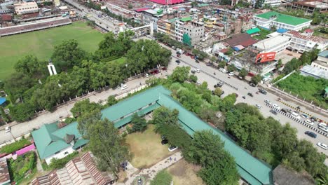 Aerial-Shot-of-Trees,-Cars,-Buildings,-People-And-Ground-In-India