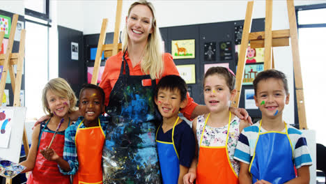 teacher and schoolkid having fun in drawing class