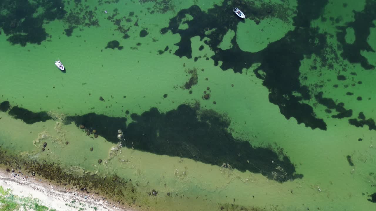Ven Island, Sweden: Drone flying overhead over the turquoise waters of Ven Island
