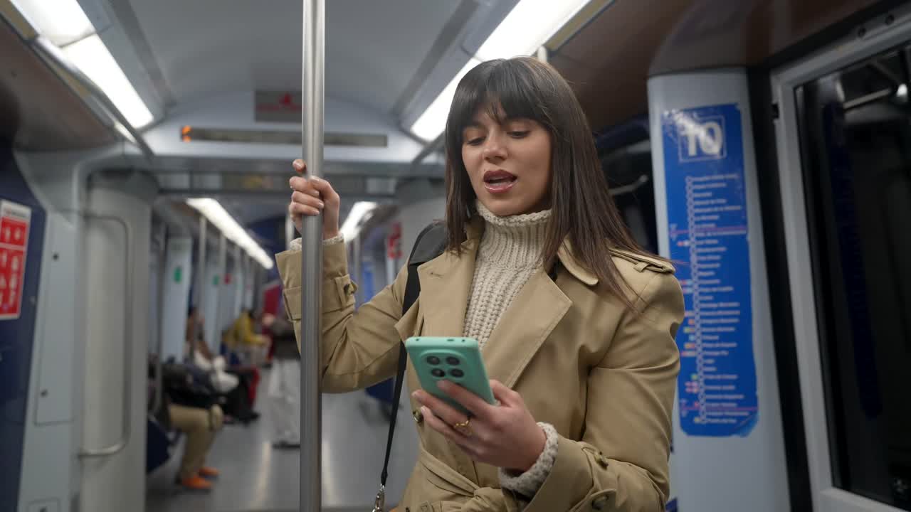 Young Woman Smiling While Commuting on a Subway Train