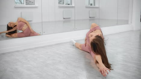 woman stretching in a dance studio