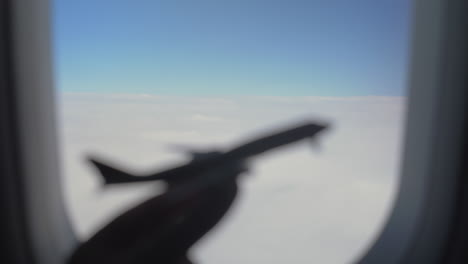 Plane-model-against-clouds-and-sky-in-illuminator