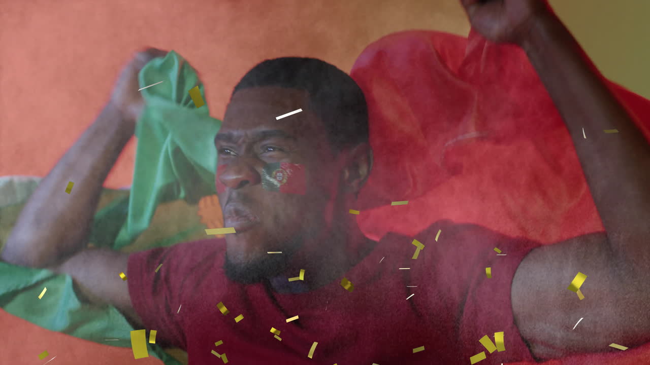 Animation of confetti falling over african american male supporter with flag of portugal