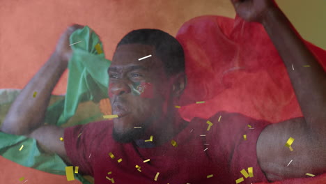 animation of confetti falling over african american male supporter with flag of portugal