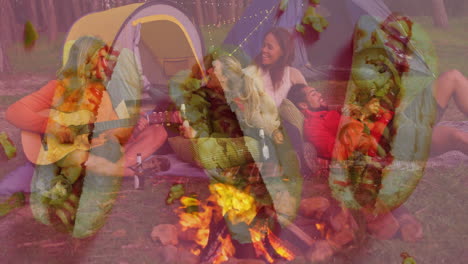 people enjoying campfire with guitar and tent, overlaid with autumn leaves animation