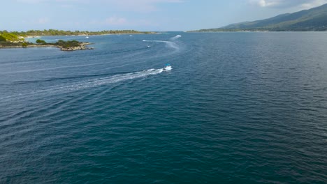 Low-water-drone-clip-of-a-jetskis-and-boats-in-the-bay-of-Vourvourou,-Halkidiki,-Northern-Greece