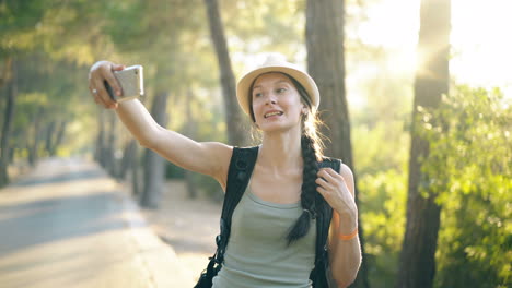 woman taking selfie in a forest