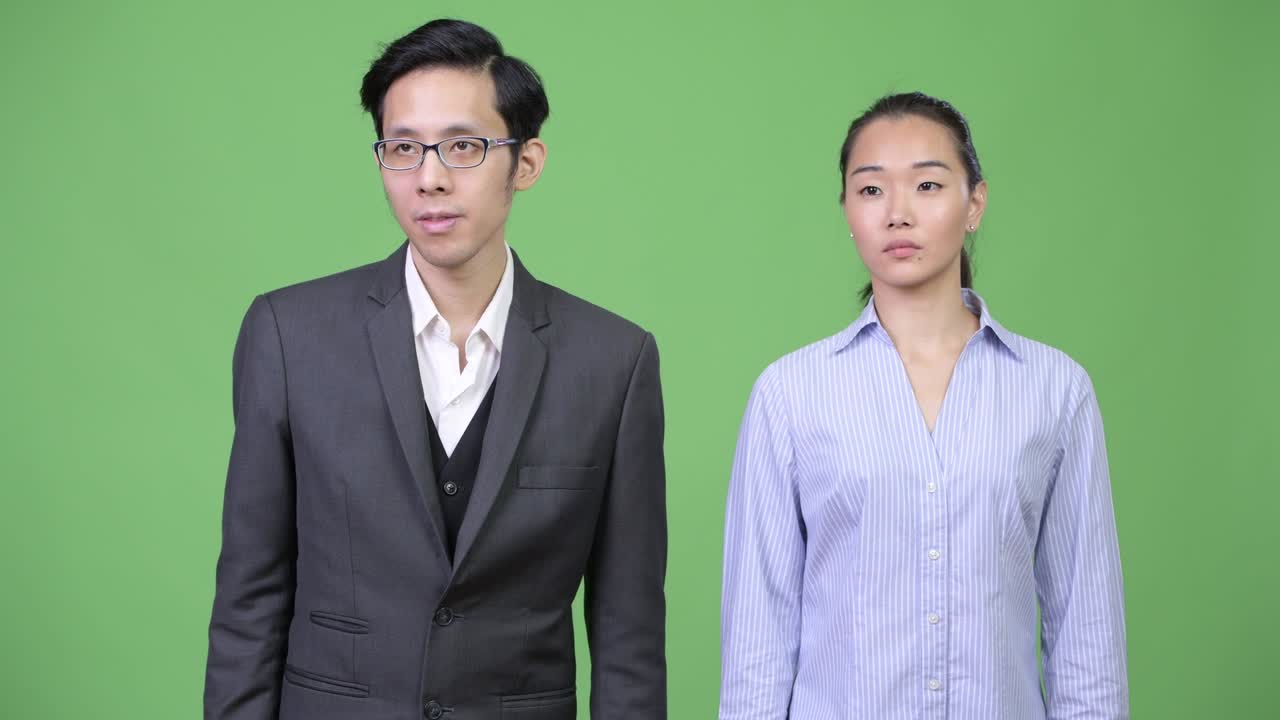 Young Asian business couple together