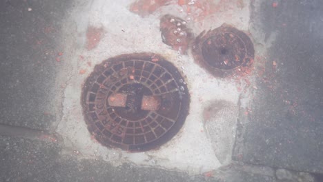 drain manhole of the city flooded by water
