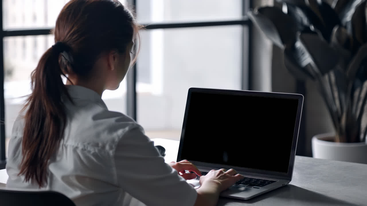 Woman working on laptop screen live mockup animated overlay, transparent 4K video, alpha channel