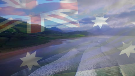 animation of flag of australia waving over sunny beach and waves breaking in sea