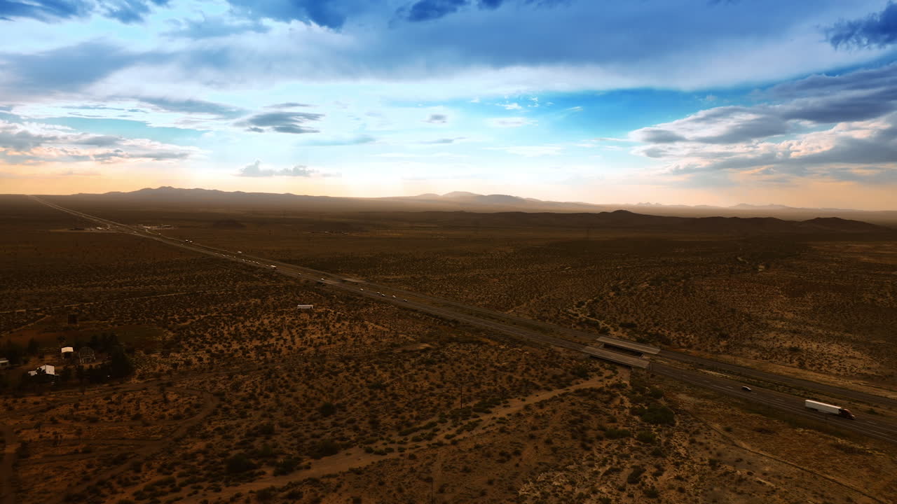 Traffic on the highways of Nevada valley. Transport moving by the roads in the dry desert. Aerial view.