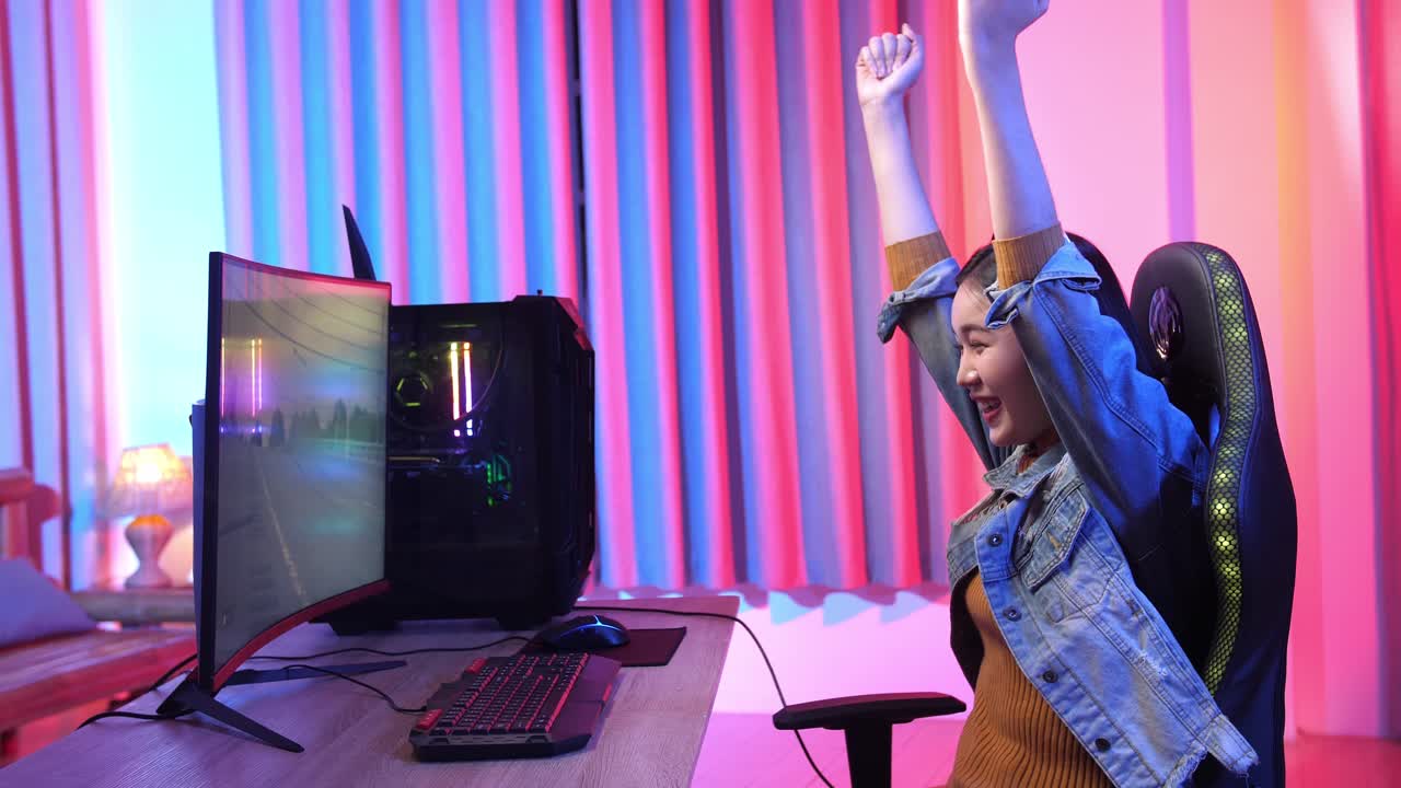 Excited Girl Making Winner Gesture While Playing Video Game