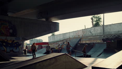 active friends riding together at skate park for leisure. young people have fun.