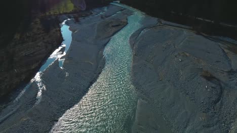 alps mountain river aerial cinemagraph seamless video loop of a scenic and idyllic canyoning waterfall with fresh natural blue water in the bavarian austrian alps, flowing along canyon forest trees. 4k uhd. rissach tyrol austria engtal ahornboden