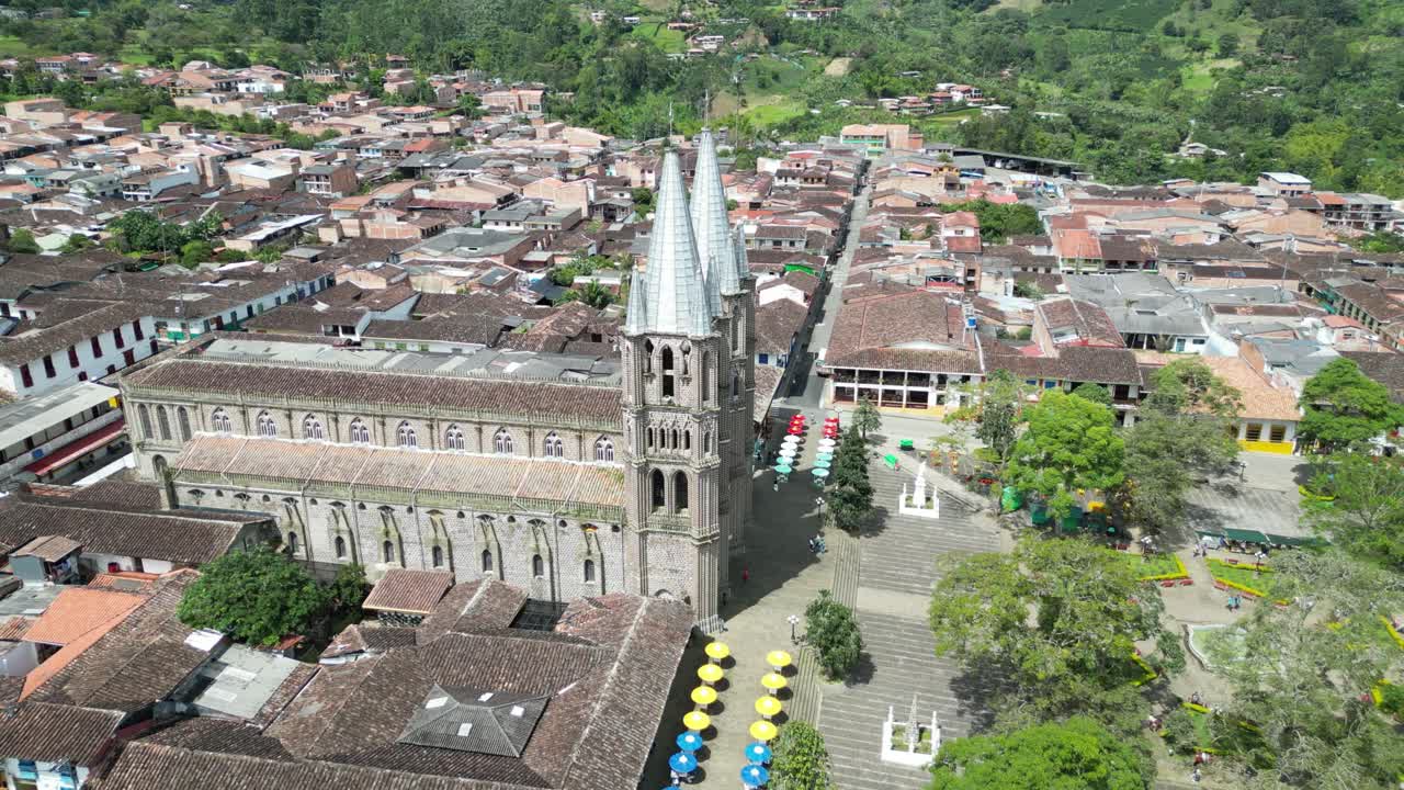 Aerial view of the picturesque church Basílica Menor de la Inmaculada Concepción and the central square in the Andean town of Jardín in Colombia